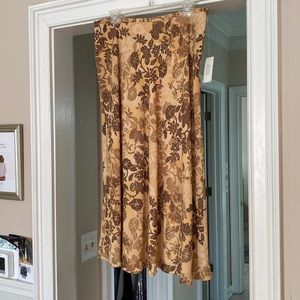 Never worn, brand new. Beautiful skirt!